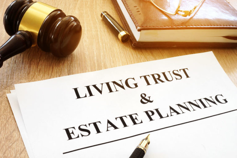 Living trust and estate planning form on a desk.