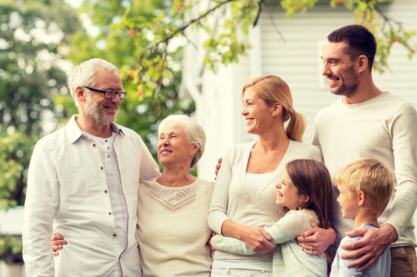 Picture of happy family with grandparents, adult children, and children exemplifying benefits of Granny Flat Exemption