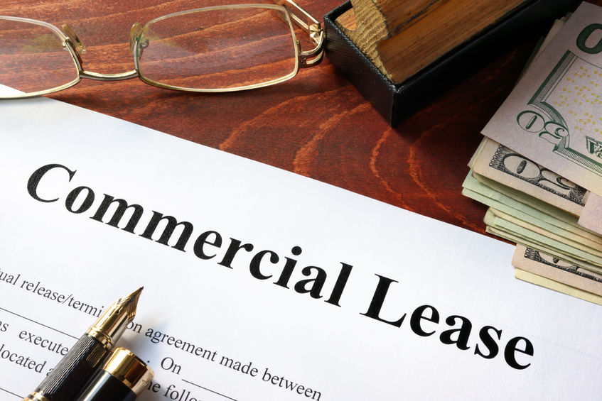 Commercial Lease document on wooden table