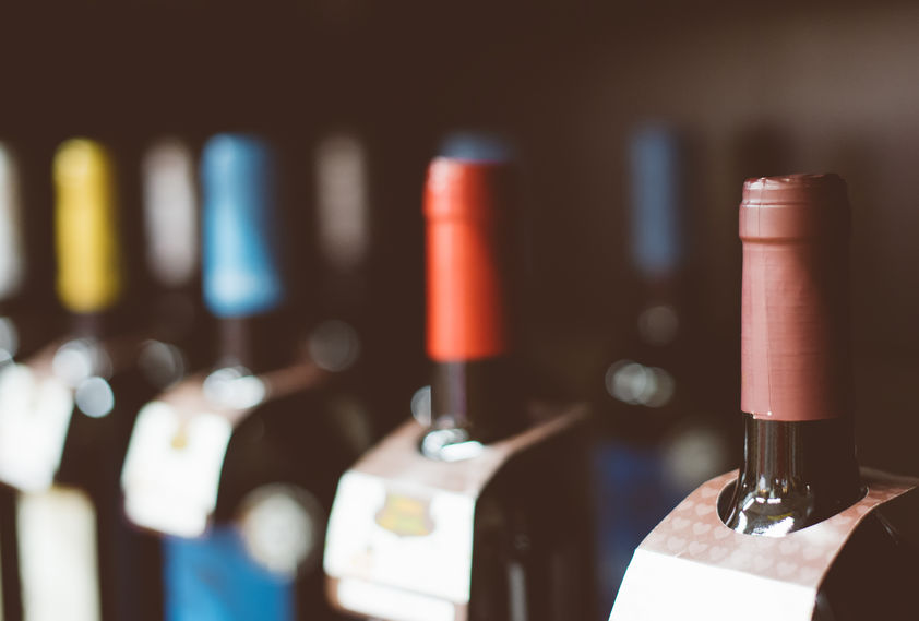 Wine bottles in the wine store referencing import requirements of alcoholic beverages