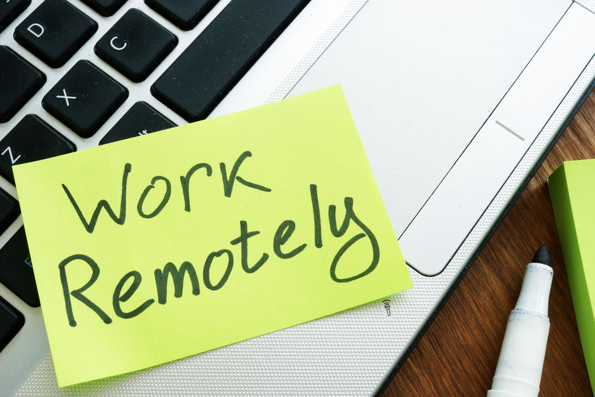 Work Remotely memo stick. Laptop for remote job.