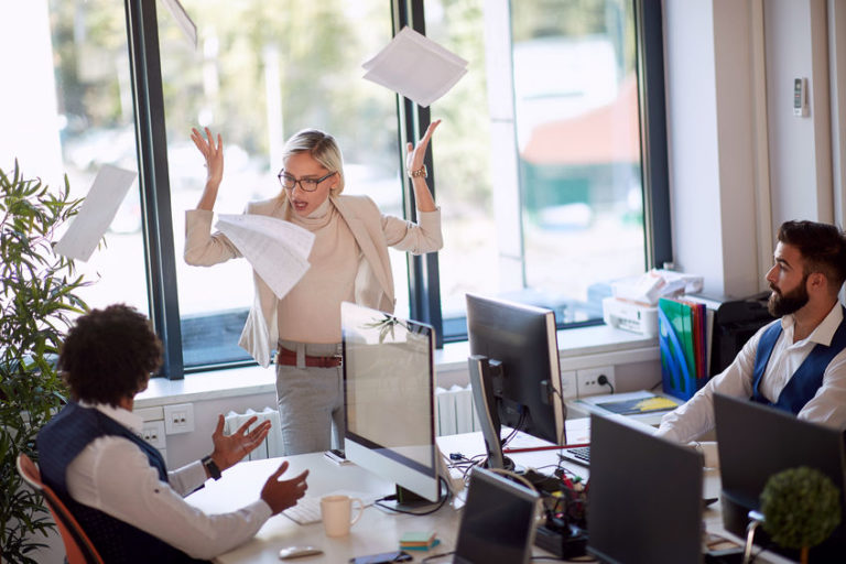 Businesswoman getting angry at a coworker in reference to hostile work environment