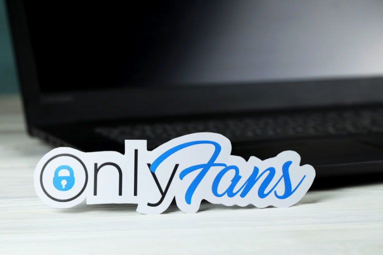Only Fans logo on top of black computer desktop in reference to legal rights for online creators