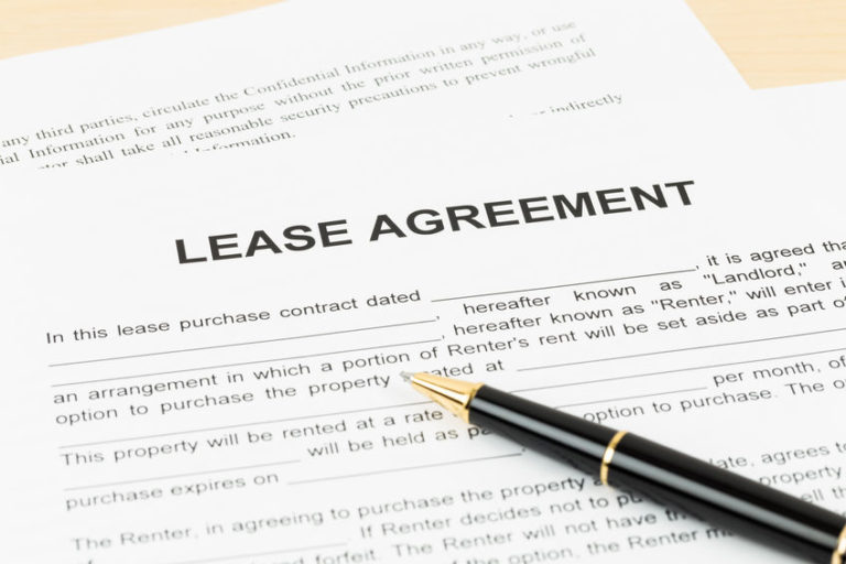 Lease agreement with pen; document is mock-up