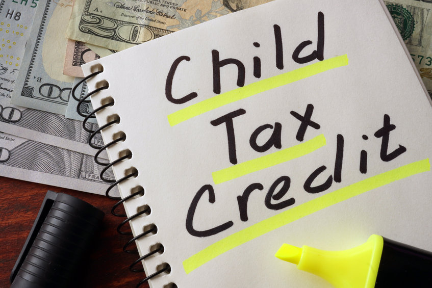 Notebook with child tax credit sign on a table. Business concept.