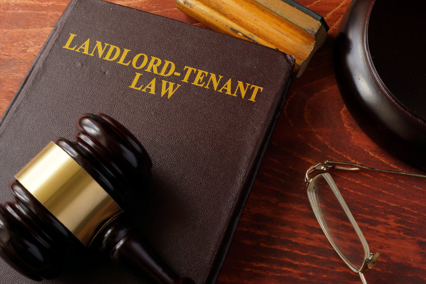 Landlord-Tenant brown book on wooden table