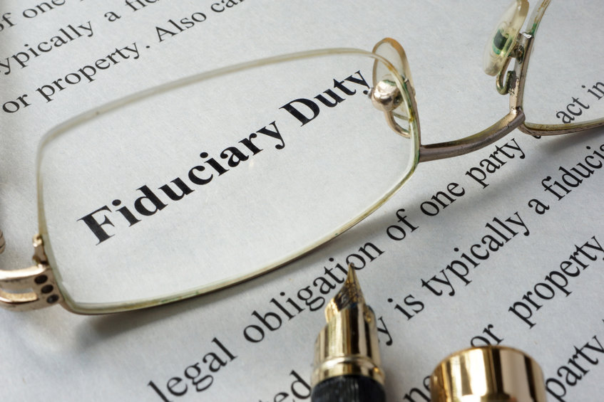 Fiduciary duty concept written on a paper.