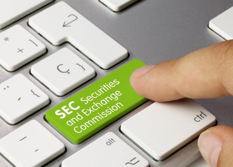 Picture of SEC securities and exchange commission written on green key of metallic keyboard.