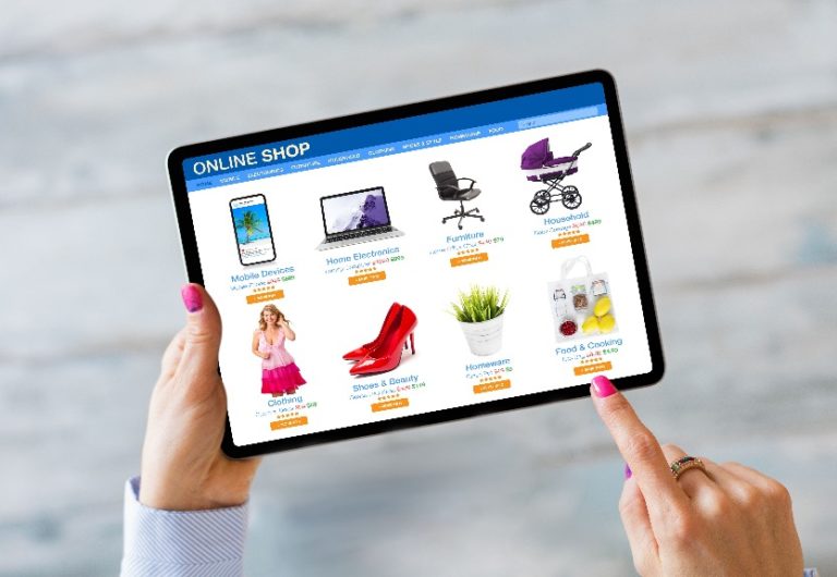 Picture of woman shopping on online retail website by using tablet computer