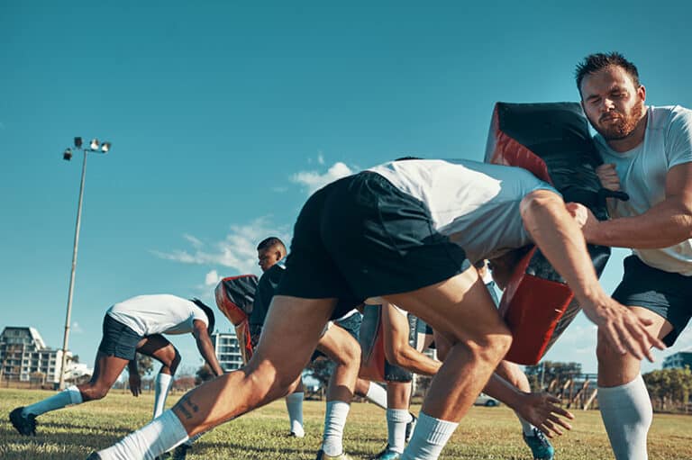 Athletes practicing football in college for NIL representation