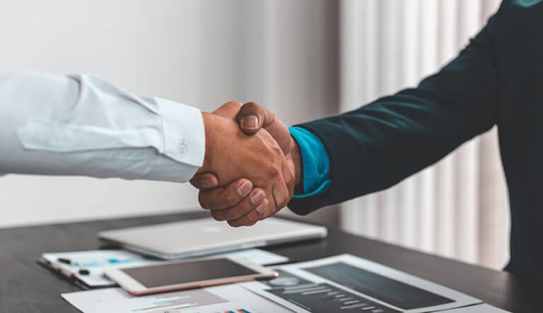 Business Handshake representing Ownership interest