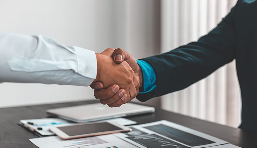 Business Handshake representing Ownership interest