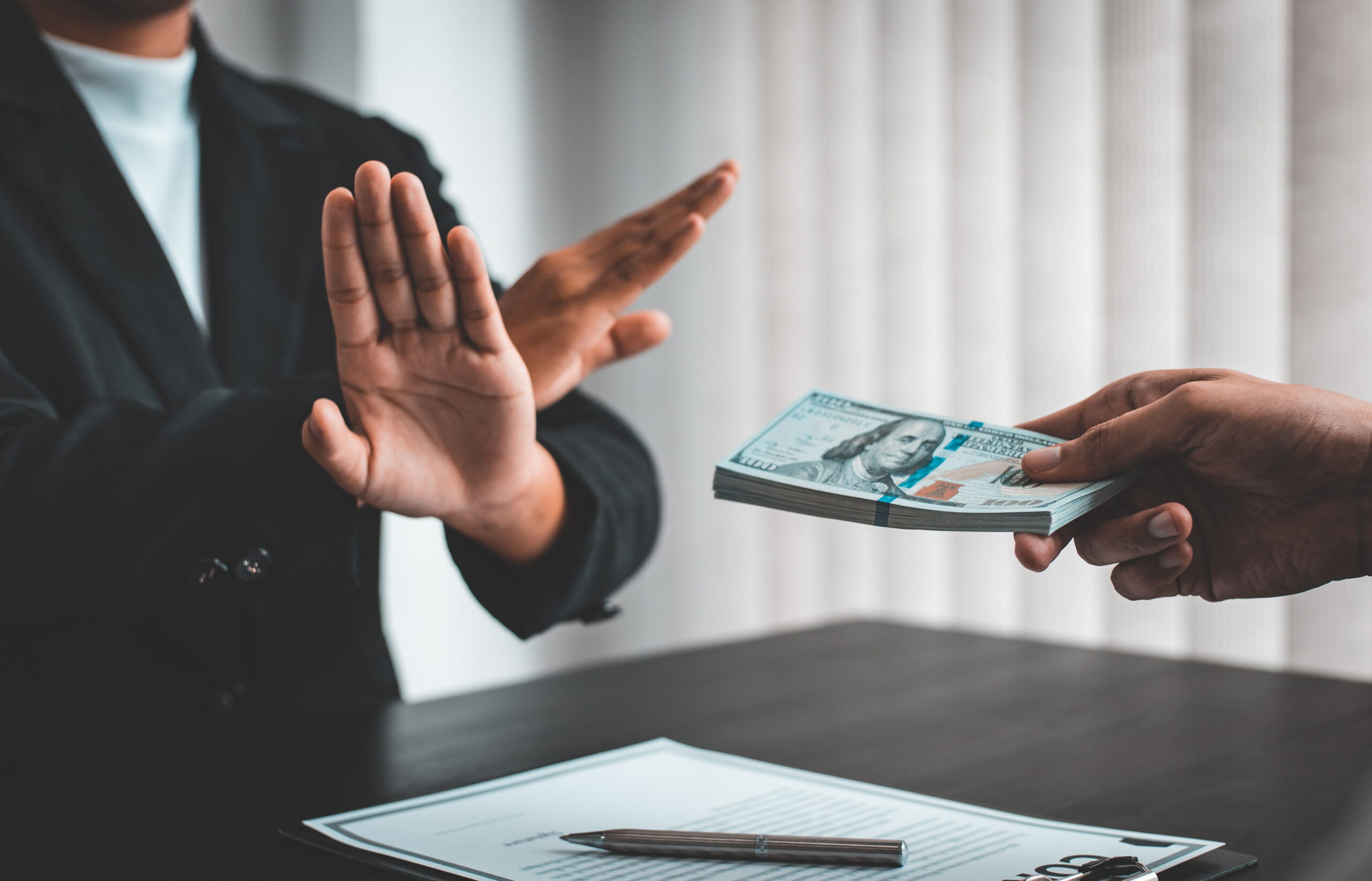 Businessmen give dollars to bribe employees in signing contracts to buy illegal land and real estate, Business fraud and social injustice, Anti Bribery and corruption concept because the FTO Designations